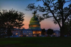 Congress - white concrete building near trees during night time