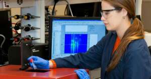 Blood Test woman in blue blazer wearing black framed eyeglasses