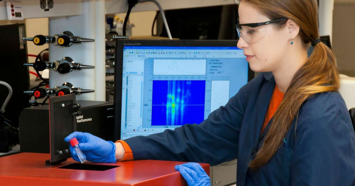 Blood Test woman in blue blazer wearing black framed eyeglasses