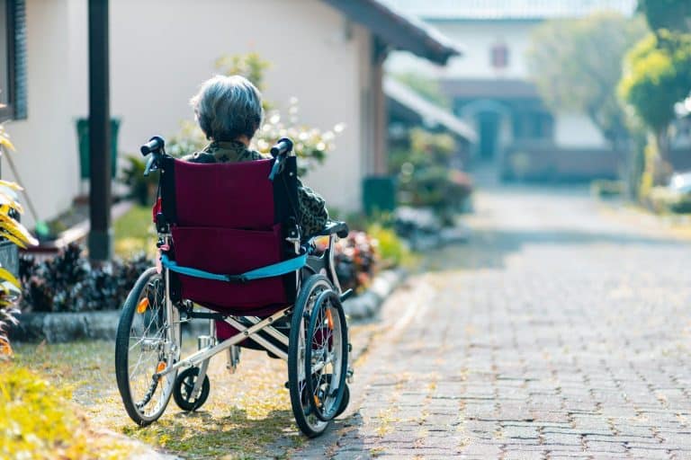 Alzheimer woman sitting on wheelchair