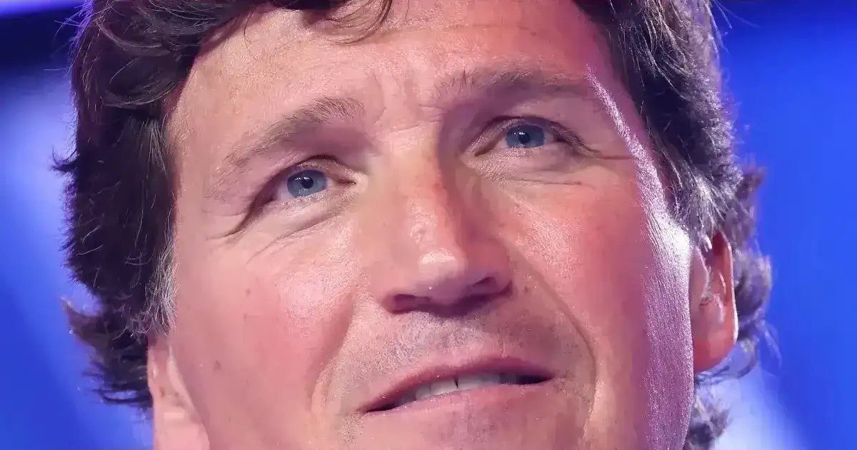 Tucker Carlson squirmed as brother pushed Clinton QAnon.